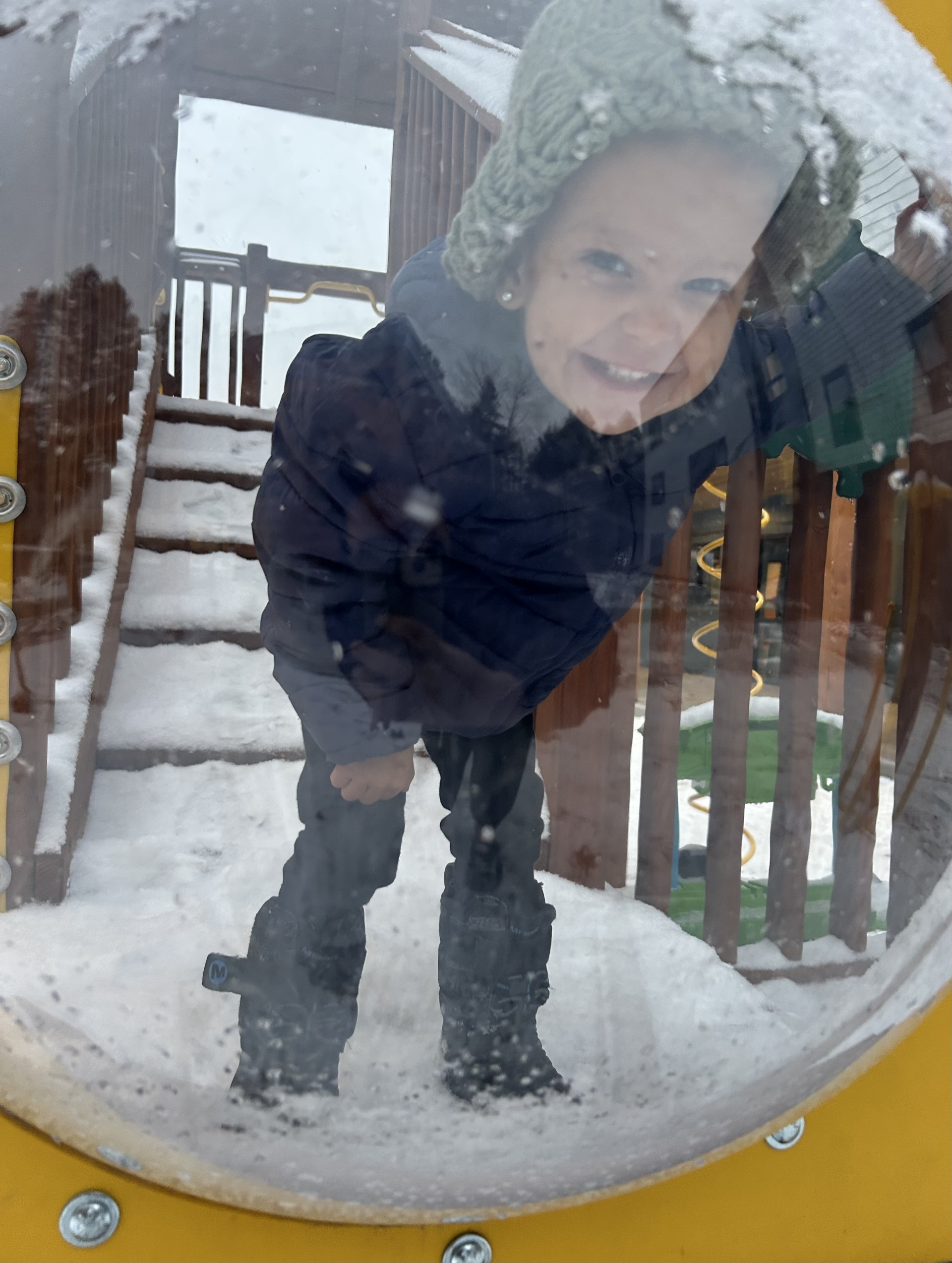 Image of a child playing on the playground at Fox Run apartments 